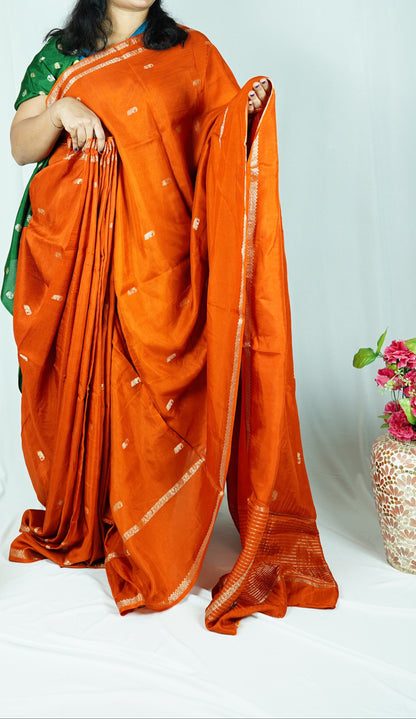 Rust orange viscose silk saree with green blouse