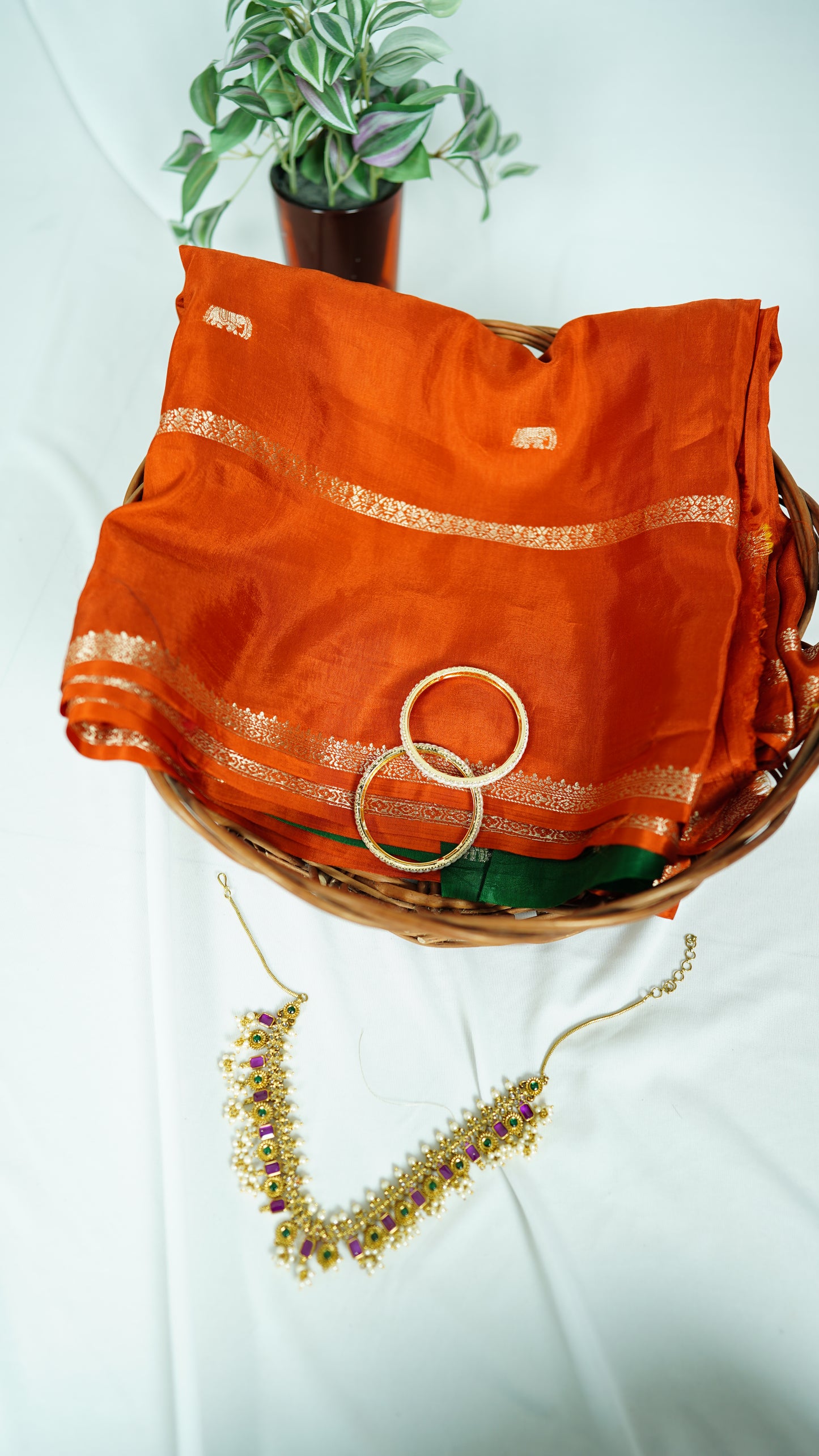 Rust orange viscose silk saree with green blouse